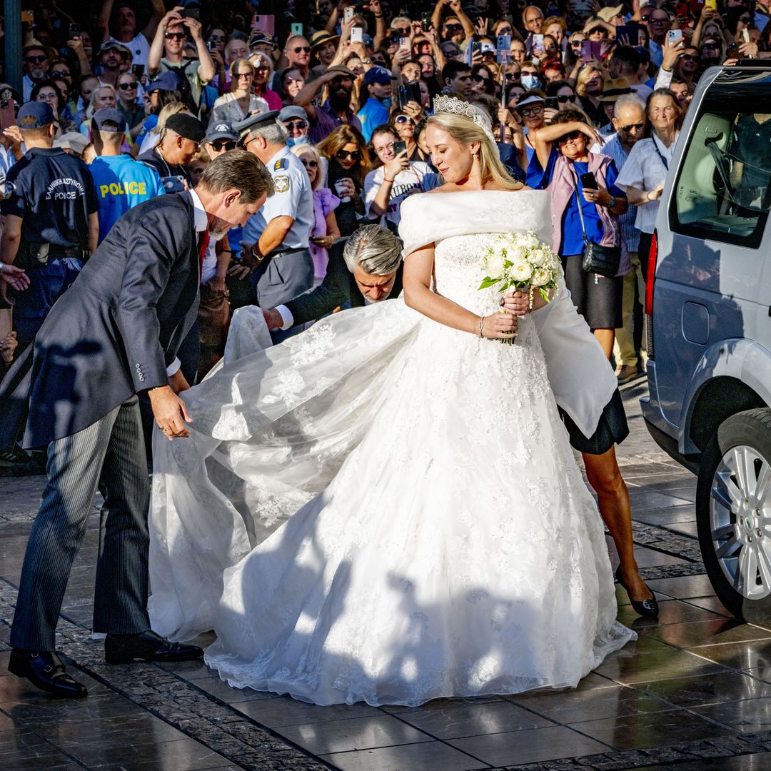 Ethereal Princess Theodora floats down aisle in bardot wedding dress and glittering tiara