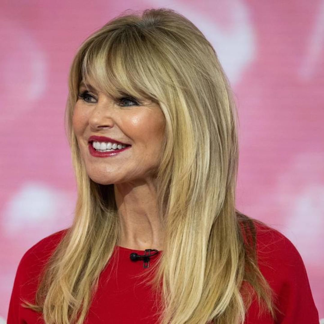 Christie Brinkley's kids approve of her red bikini look as she poses for beachside photos