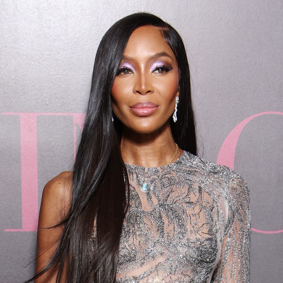 Naomi Campbell disguises mystery bandages beneath rippling slip dress during runway show