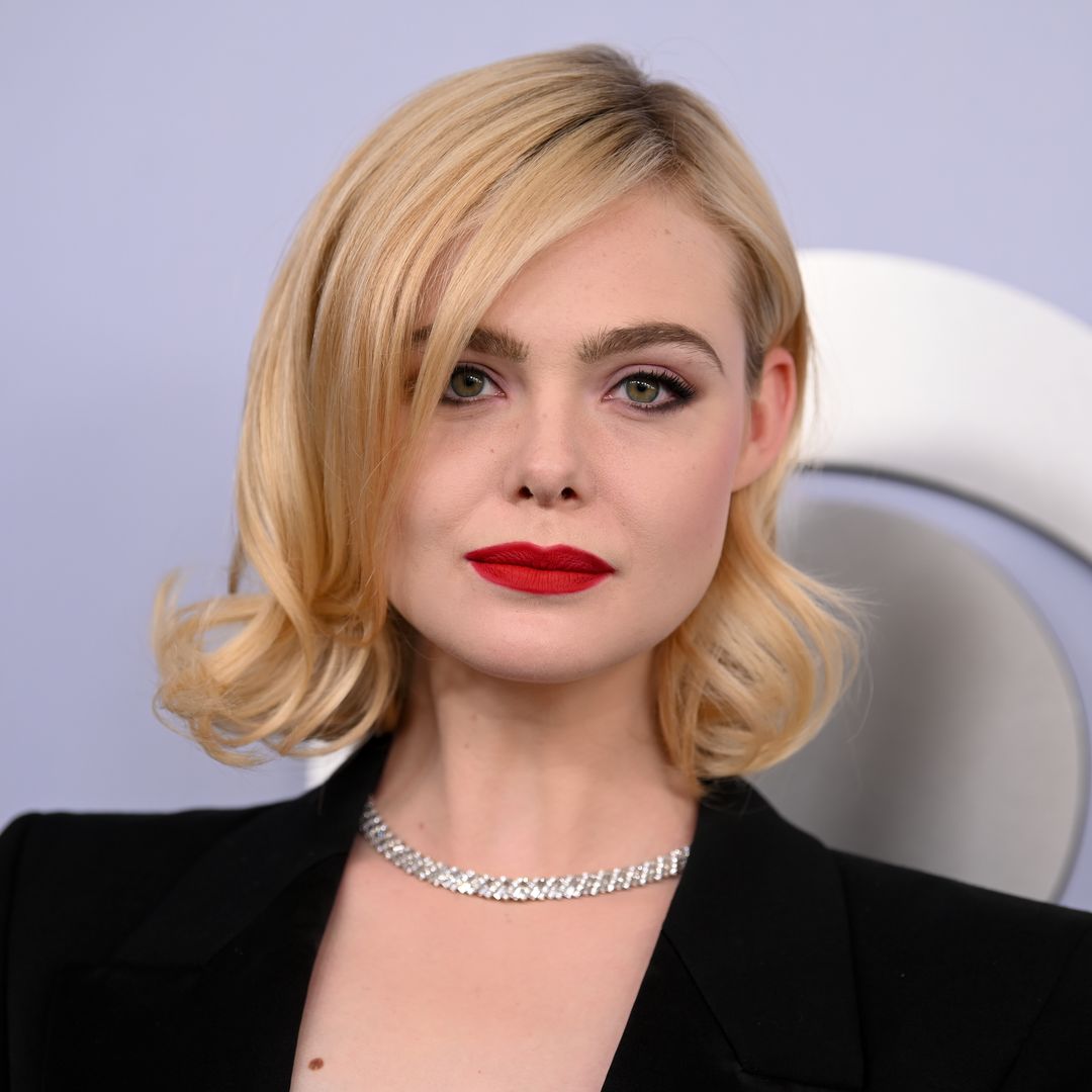 Elle Fanning's plunging suit and red lip is giving major SHE-E-O vibes