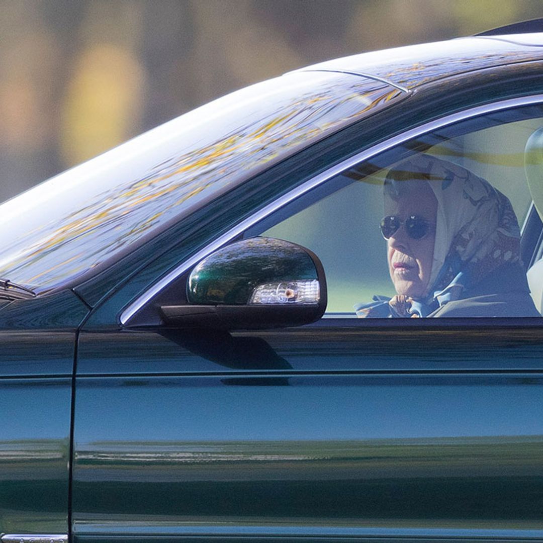 The Queen pictured driving at Windsor Castle in first public outing since hospital stay