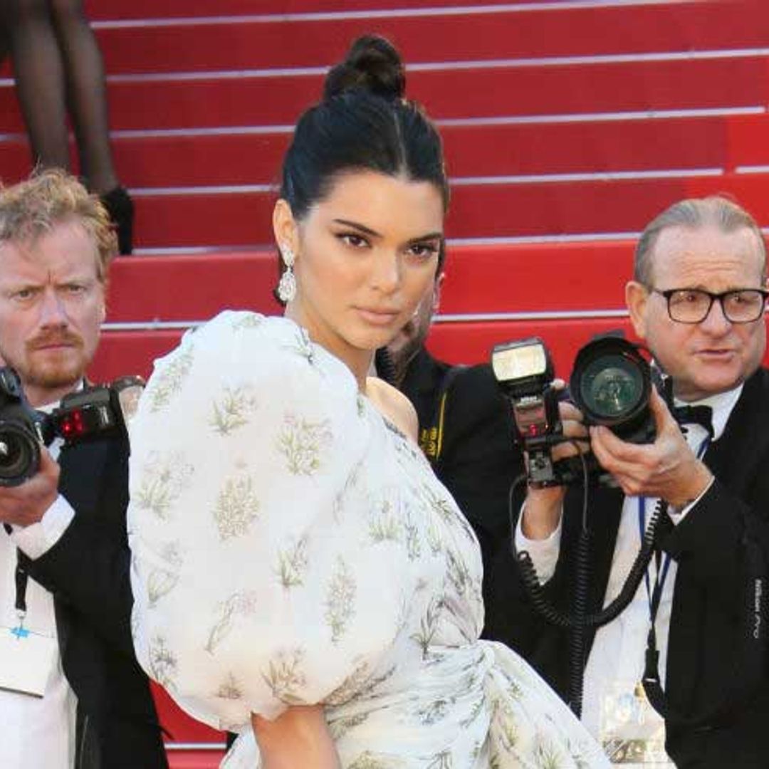 Kendall Jenner works a socks and Jimmy Choo sandals look on the red carpet