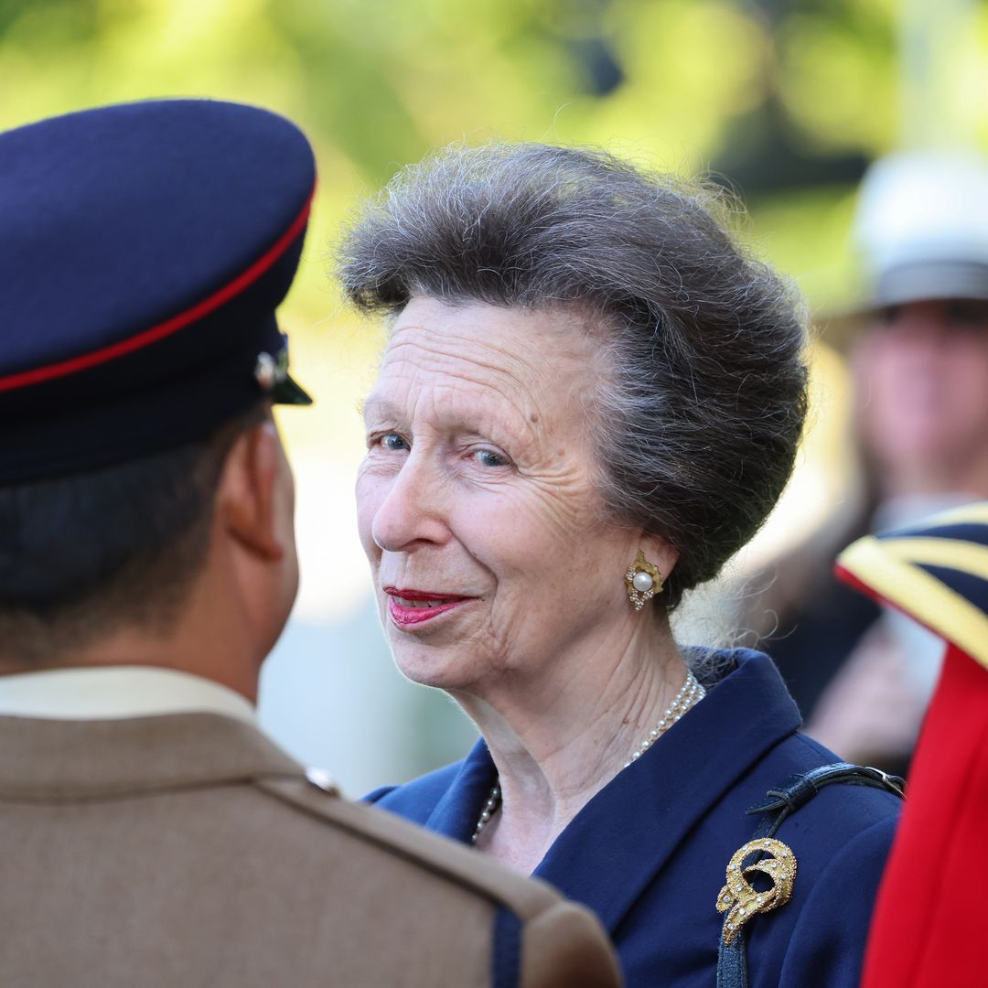 Princess Anne models tailored jacket and Adidas shades in France