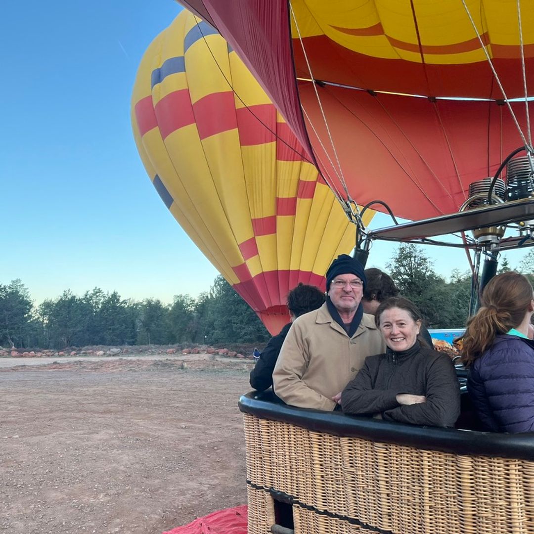 Kami Cotler and her husband Kim Howard pose for a photo in a hot air balloon, shared on Facebook