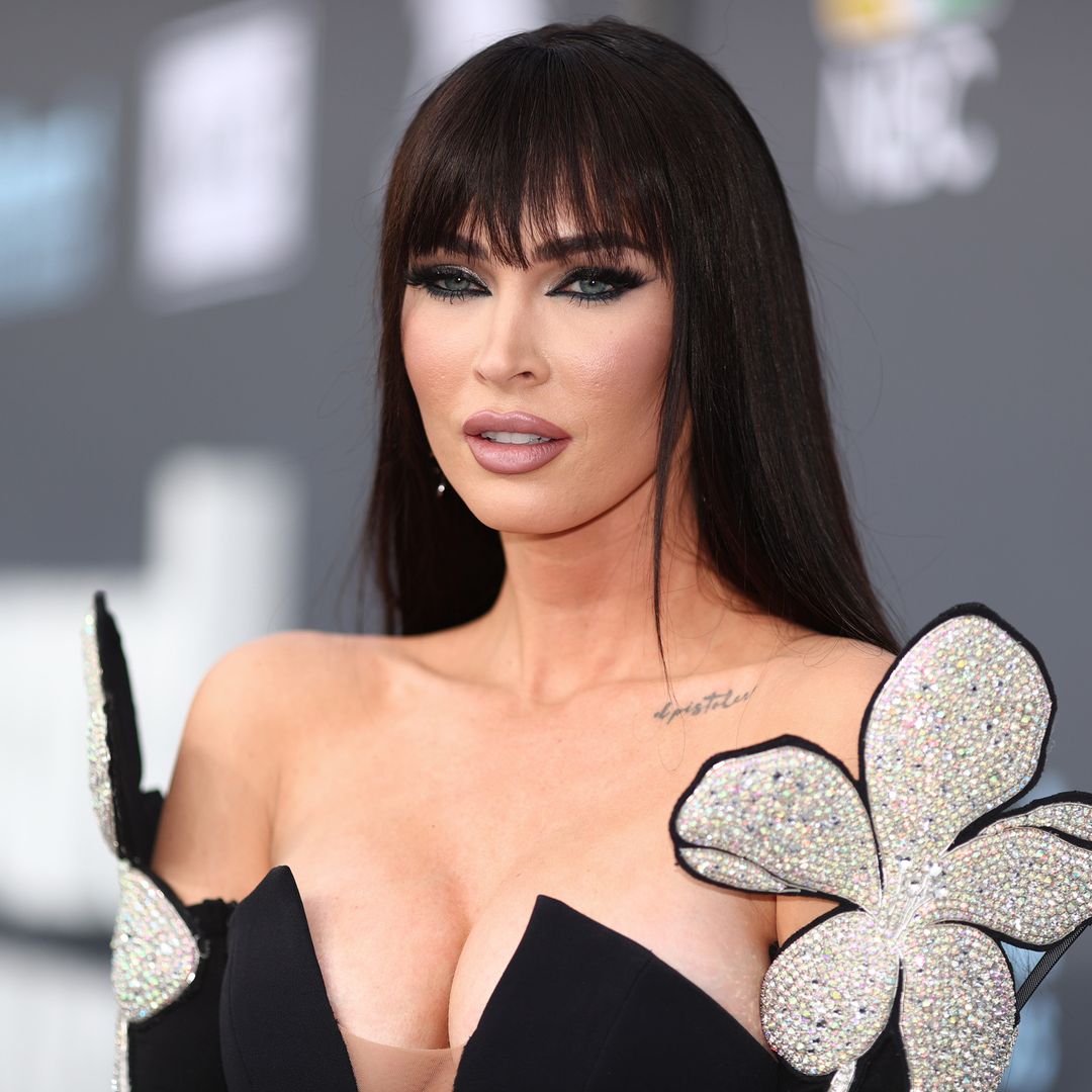 Megan Fox rocks sheer bodysuit and knee-high boots in unexpected hair transformation