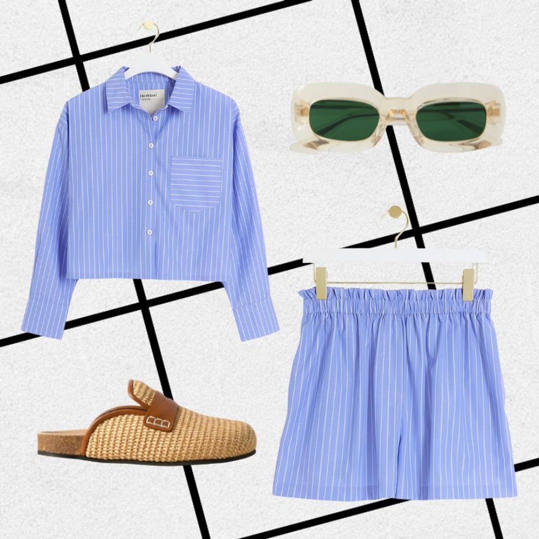 Beach outfit consisting of blue striped shirt, shorts, raffia clogs and clear sunglasses 