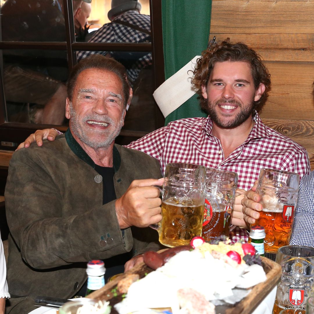 Arnold Schwarzenegger's son Christopher flexes biceps after 30lb weight loss during 'perfect' day with rarely-seen family