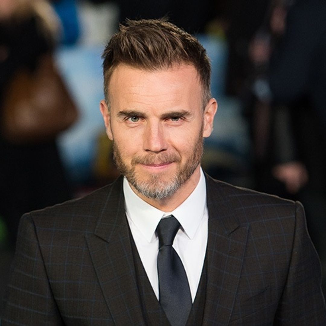 Gary Barlow and lookalike son Daniel enjoy night out at football match - see the sweet photo