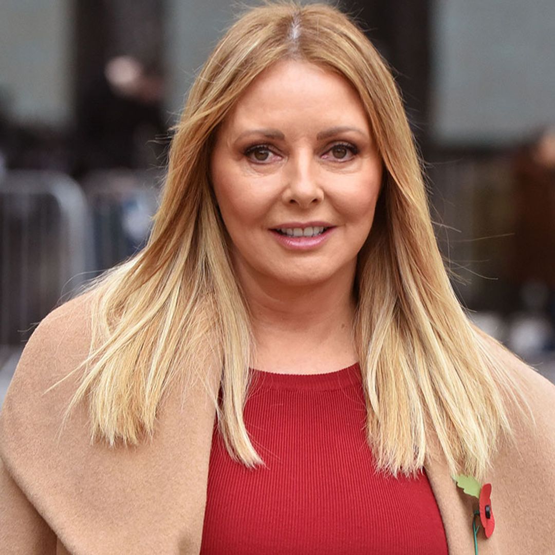 Carol Vorderman looks like a Baywatch star in bold red cut-out swimsuit