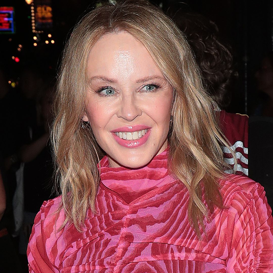 Kylie Minogue looks better than ever in striking sheer dress and thigh-high boots