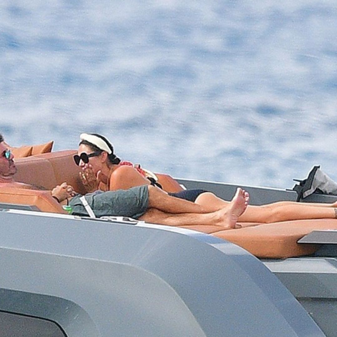 Lauren Silverman shows off fabulous figure as she cosies up to Simon Cowell on boat
