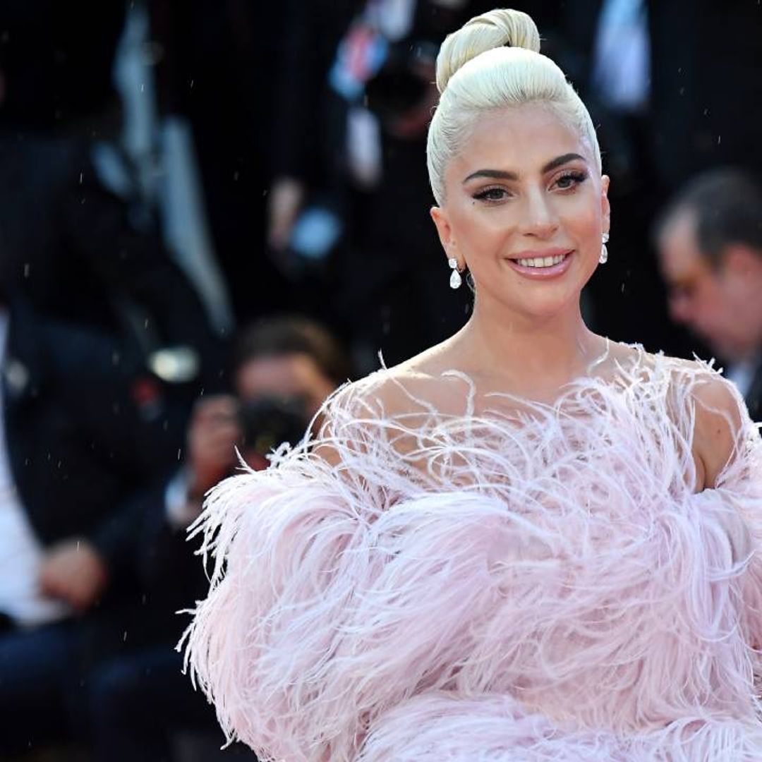 Lady Gaga channels her inner Vegas showgirl in a sheer dress with a daring slit