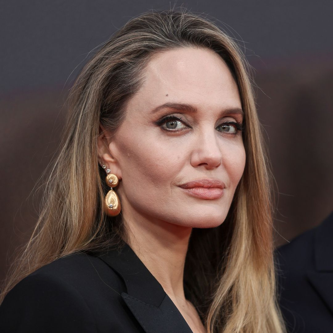 Angelina Jolie is a Hollywood siren with vampy red nails amid 'loneliness' confession