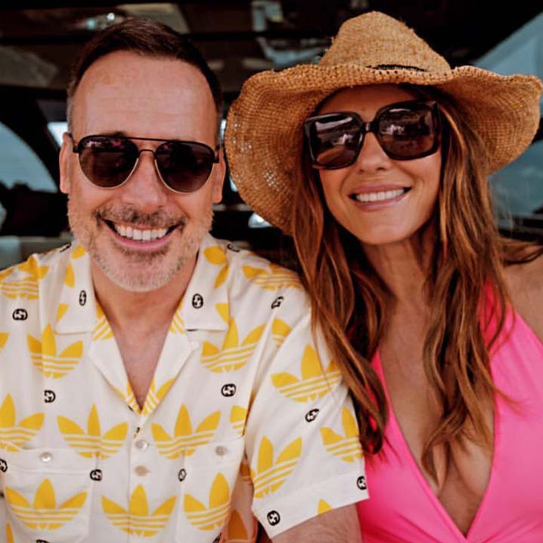 Elizabeth Hurley stuns in pink low-cut swimsuit as she relaxes on board a yacht