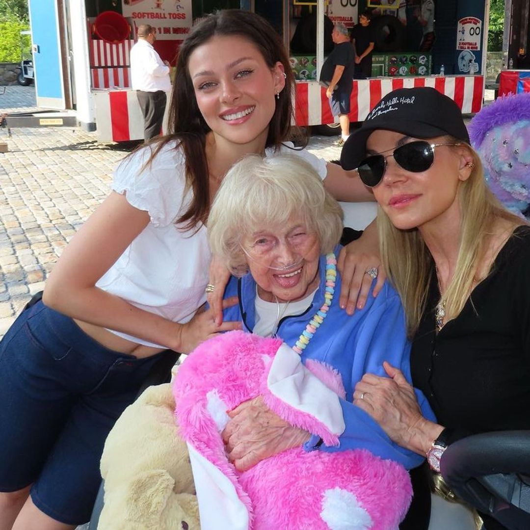 Nicola Peltz wearing dark denim shorts to celebrate her grandmother's 95th birthday 