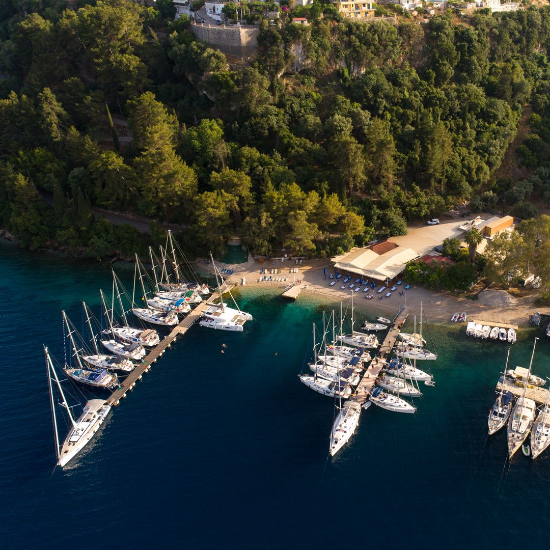 Sailboats and yachts in small port Near village Spartachori on Meganisi island, Greece
