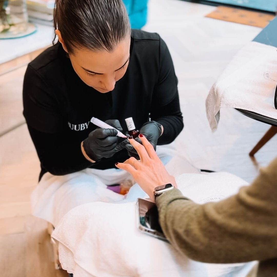 woman having a manicure at home