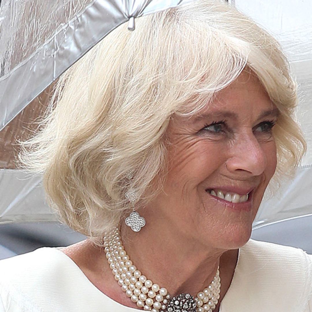 Queen Camilla channelled Princess Charlene's rarely-seen wedding dress with rule-breaking gown