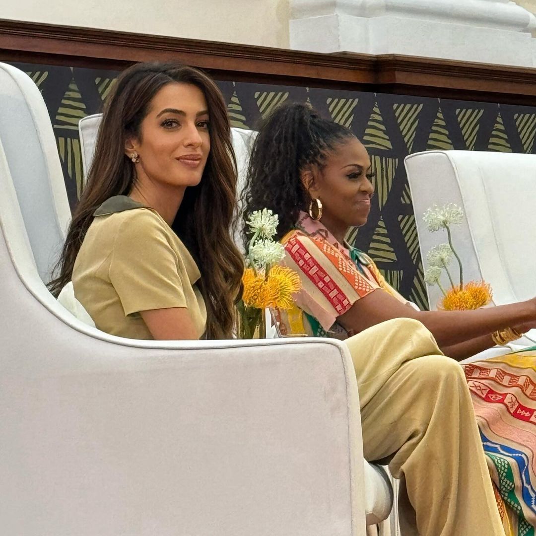 Amal Clooney dons camel co-ord to support Michelle Obama and Melinda Gates at landmark event