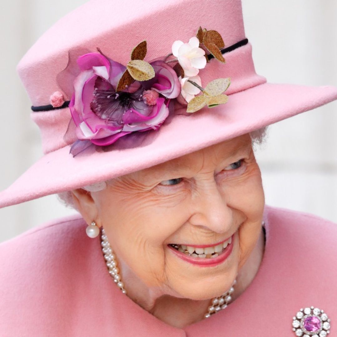 The Queen wears bold lipstick and florals for smiling new appearance