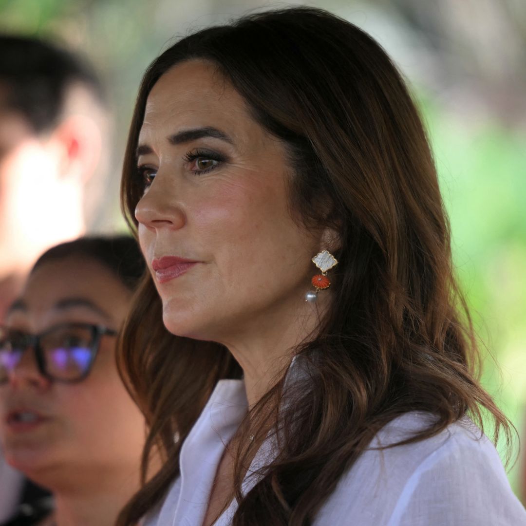 Queen Mary is an icon of modern royal style in asymmetrical belt and wide-leg trousers