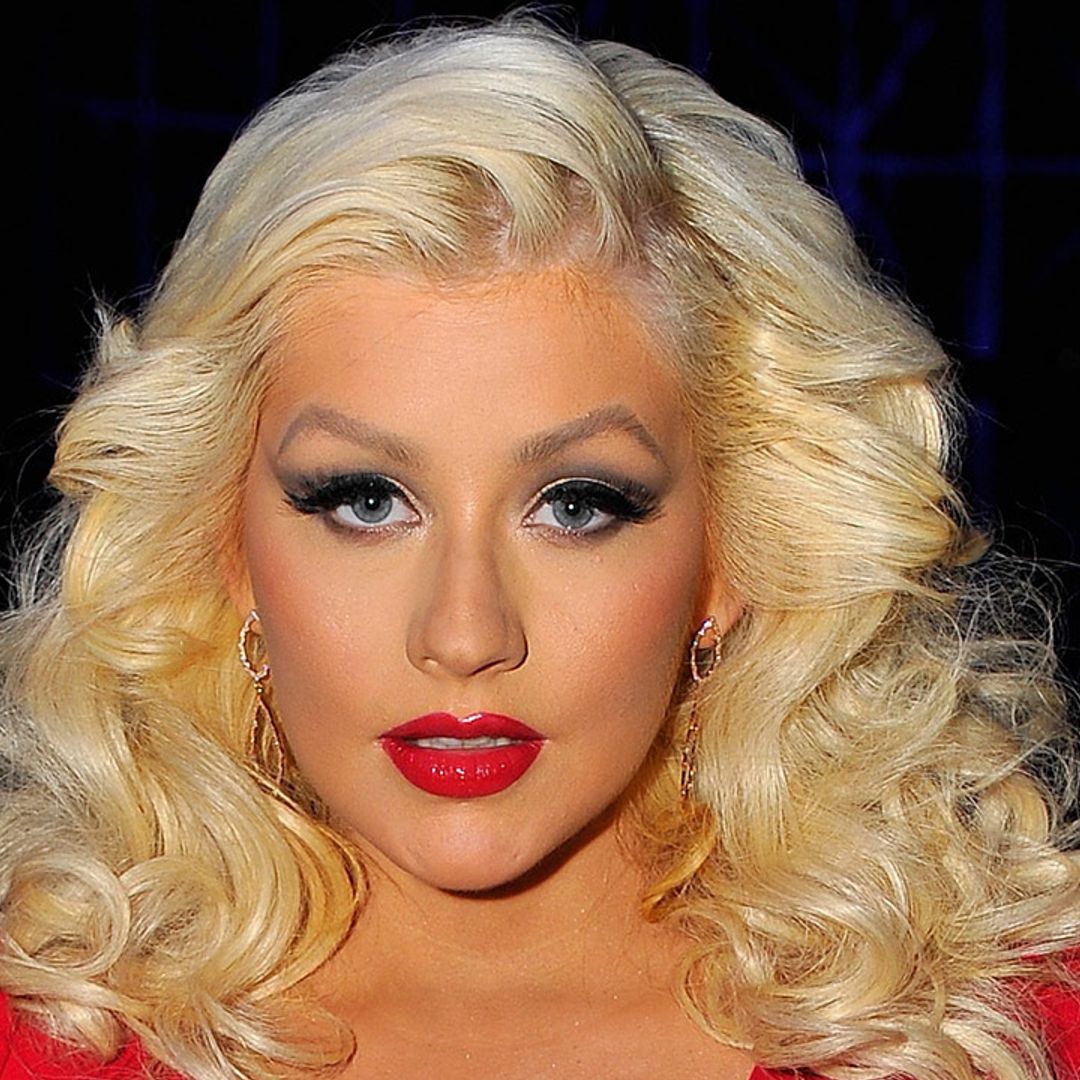 Christina Aguilera is the ultimate goddess in fishnet tights and thigh-high boots