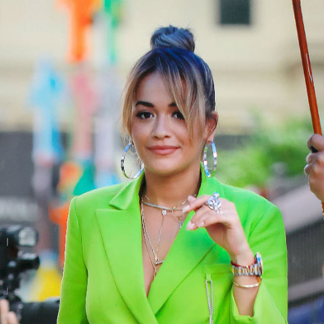 Rita Ora steps out in New York in a lime green Osman trouser suit