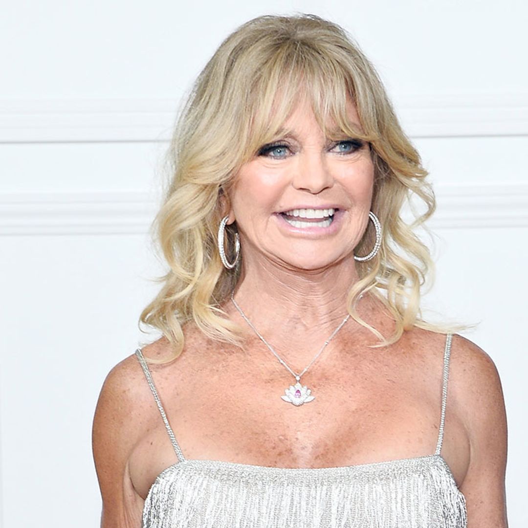 Goldie Hawn dances around in the water in stunning V-neck swimsuit during Greek holiday