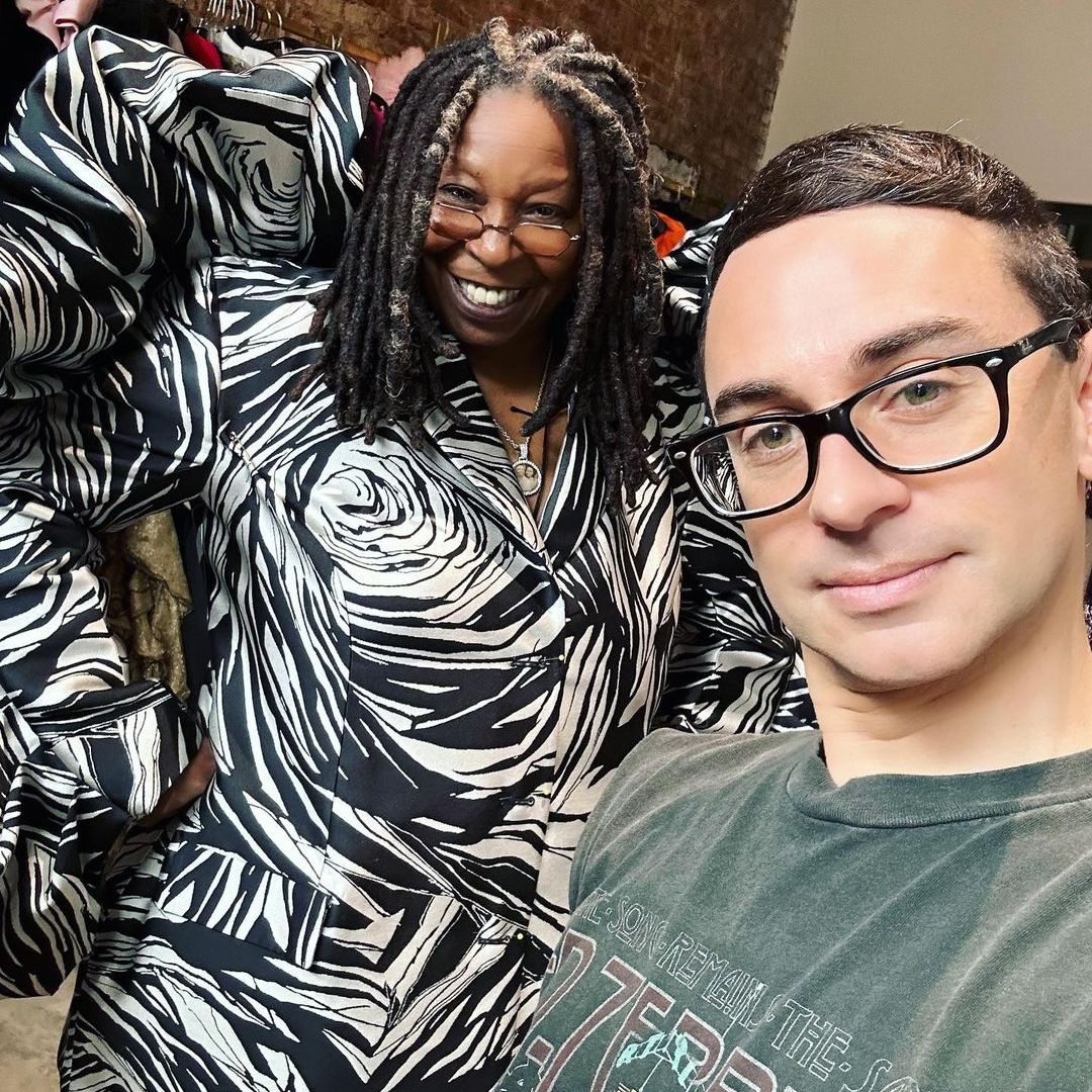 Whoopi and Christian behind the scenes smiling for a selfie