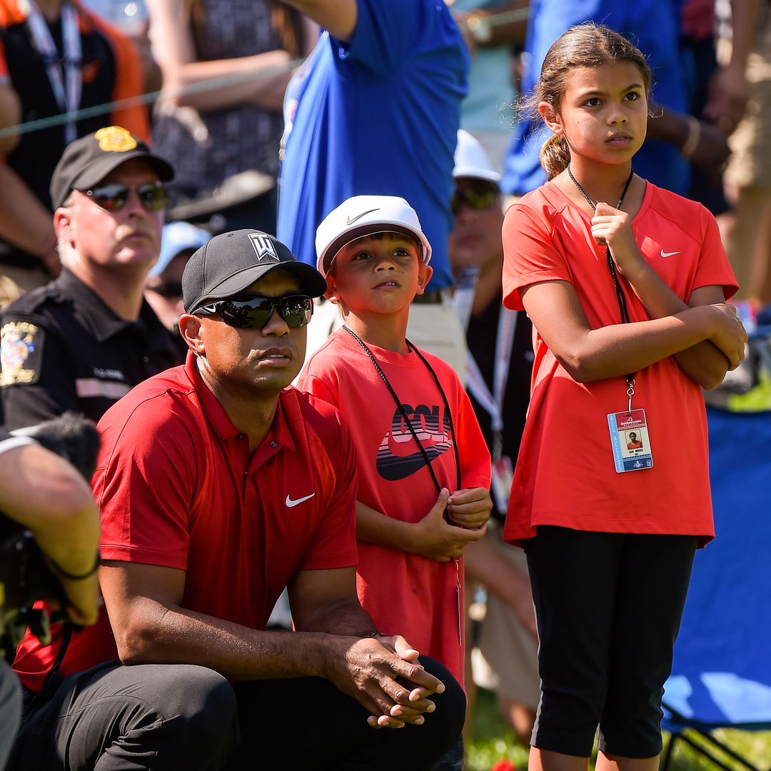 Tiger Woods watches the grouping of Billy Hurley III and Ernie Els of South Africa with his kids Sam and Charlie during the final round of the Quicken Loans National at Congressional Country Club (Blue) on June 26, 2016 in Bethesda, Maryland.