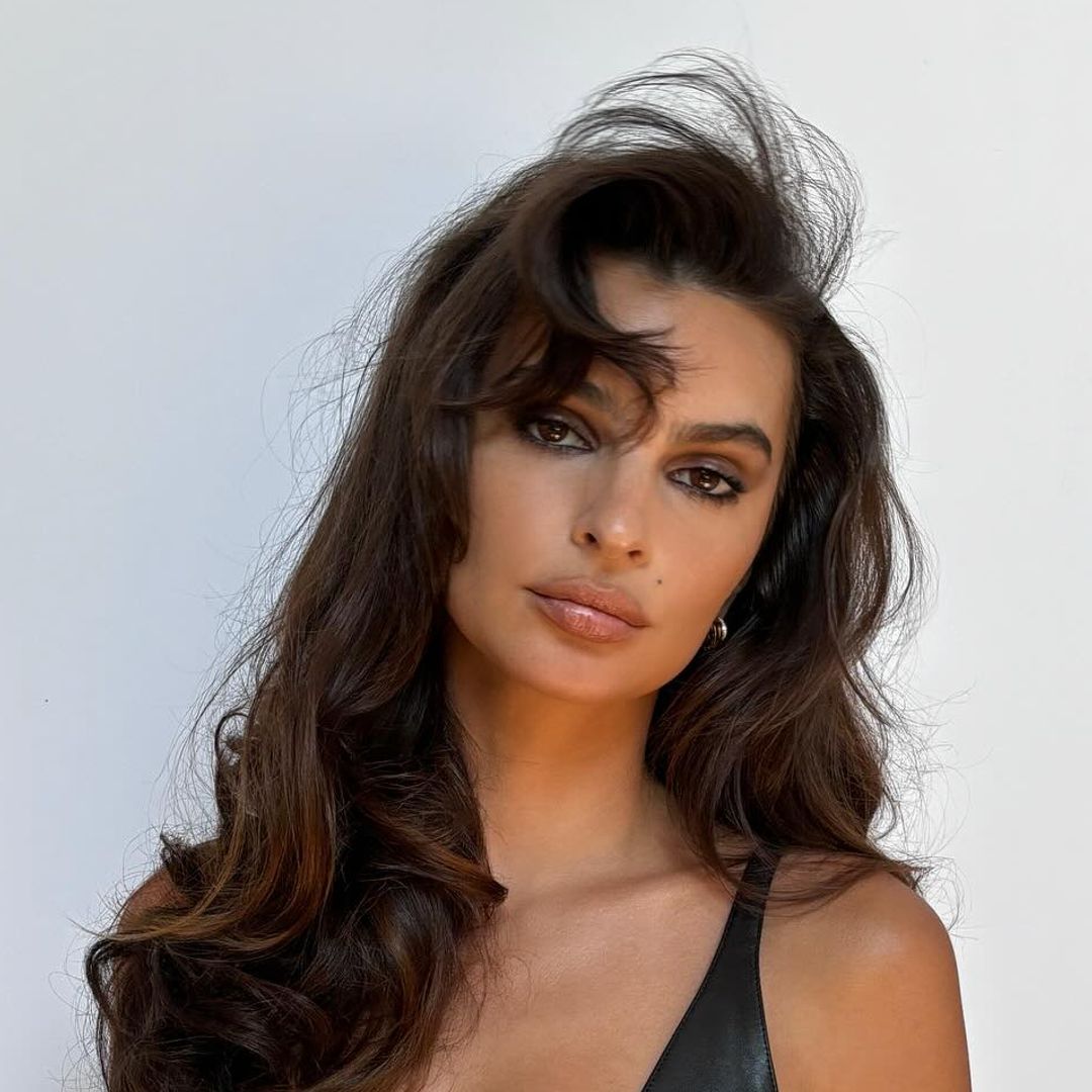 Emily Ratajkowski is a modern day pin-up in lingerie leather crop top and completely sheer capris