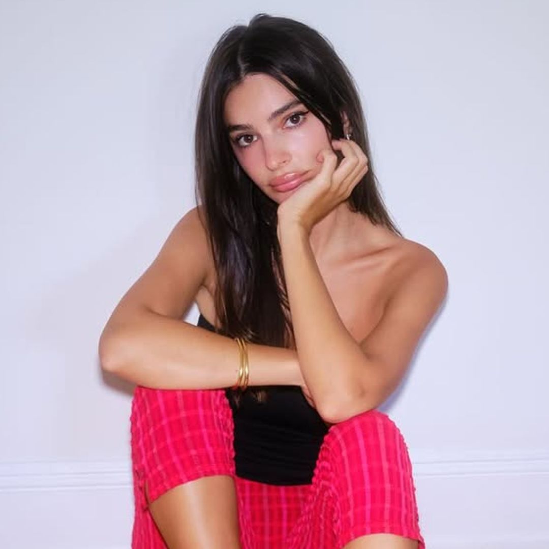 Emily Ratajkowski clings onto summer in bandeau top and capri pants
