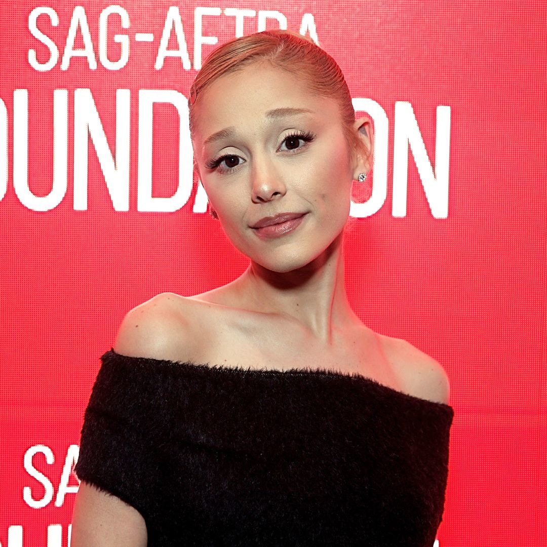 Ariana Grande looks nearly unrecognizable as she ditches Glinda pink for vampy black dress