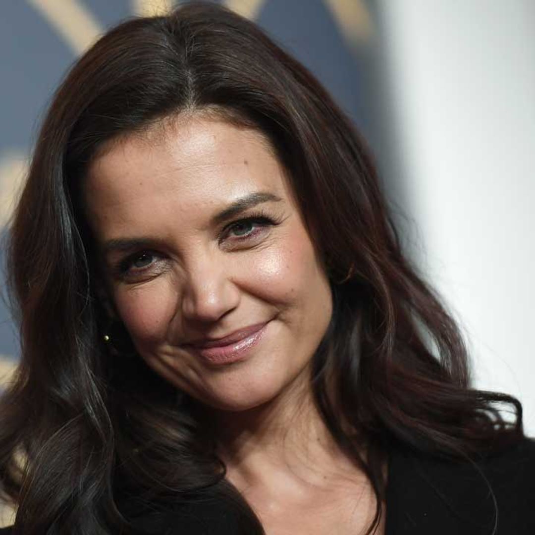 Katie Holmes rocks leather trousers for a quick visit to Berlin Fashion Week