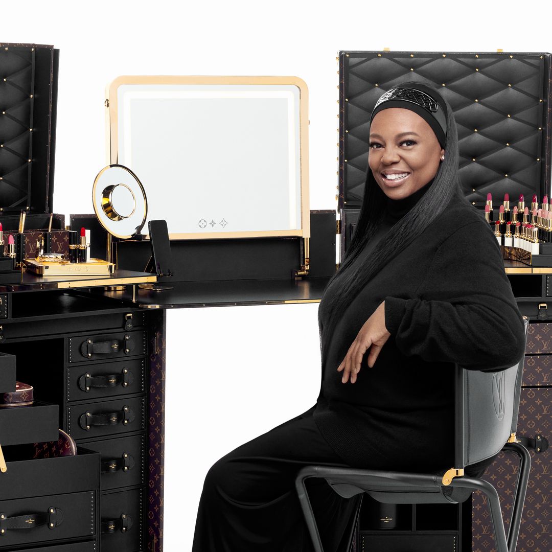 Pat Mcgrath sitting at an LV makeup trunk