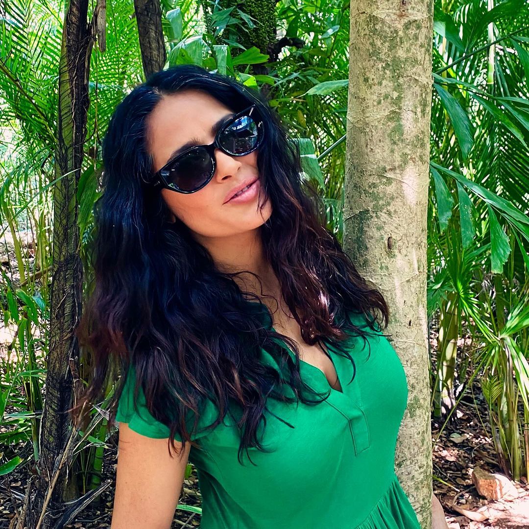 Salma Hayek hugs a tree as she joins the celebrities honoring Earth Day