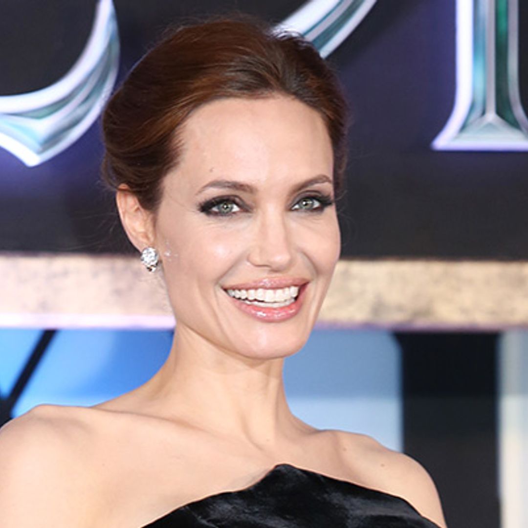 Angelina Jolie turns heads as she steps out in elegant black dress with son Pax