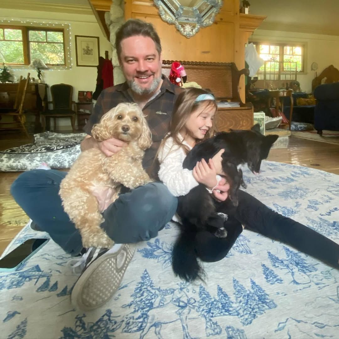 Nathan Hamill, his daughter Autumn, and their two dogs pose for a Christmas photo inside their home, shared on Instagram