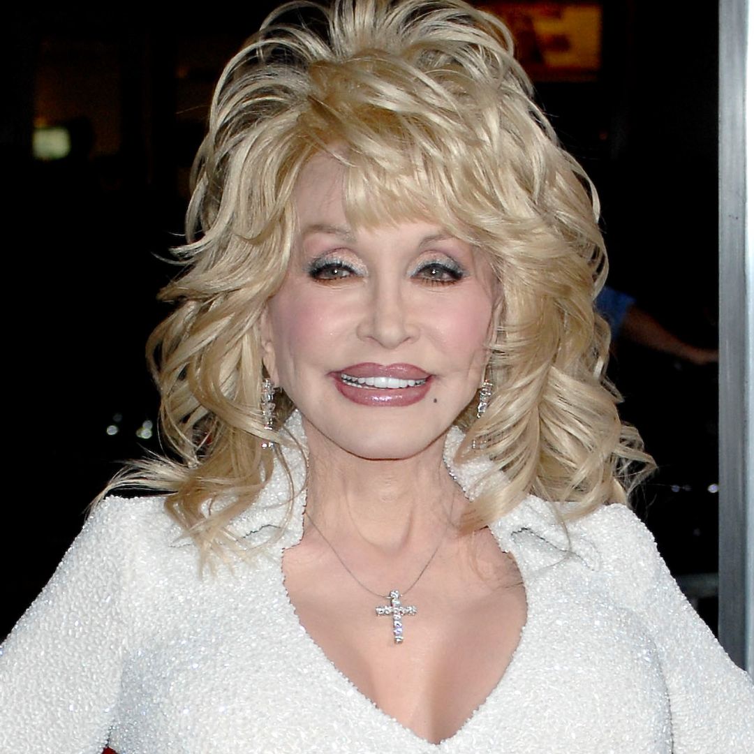 Dolly Parton is defiant in skintight pants and plunging corset following difficult confession