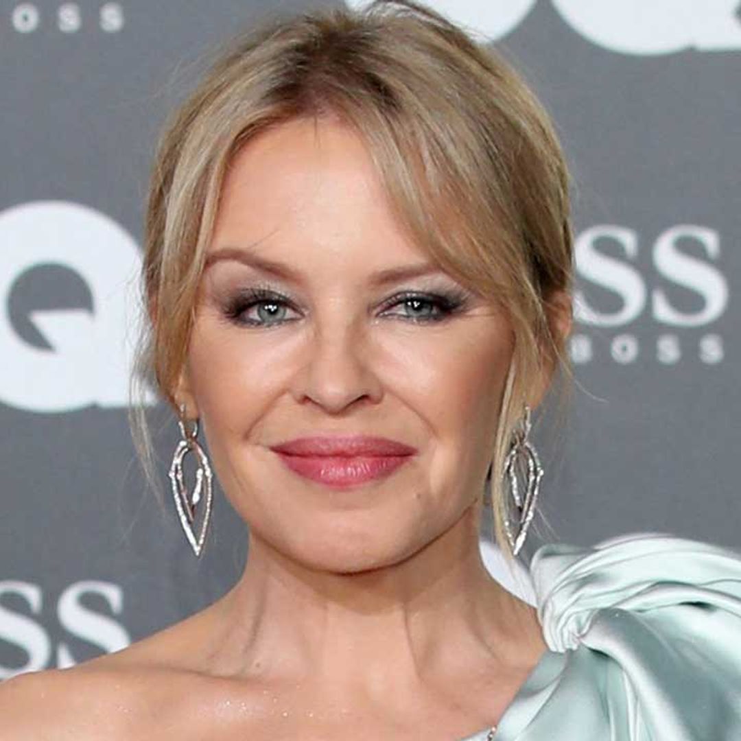 Kylie Minogue looks incredible in feathered mini dress as fans react