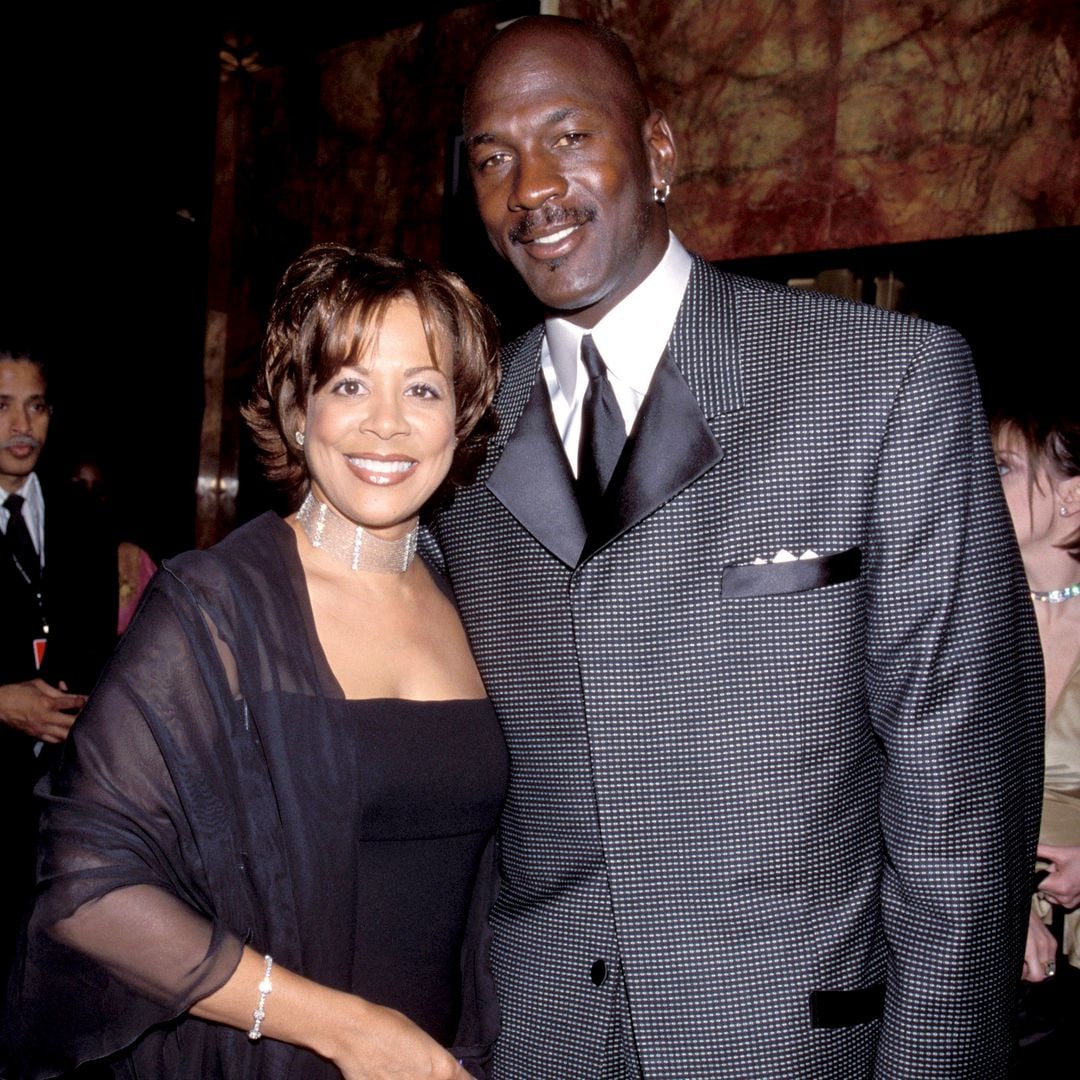 Michael Jordan and his ex-wife Juanita Jordan smiling for a photo at an event
