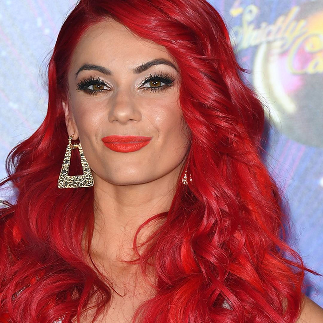 Dianne Buswell bats her lashes for the camera in glittering sleeveless gown