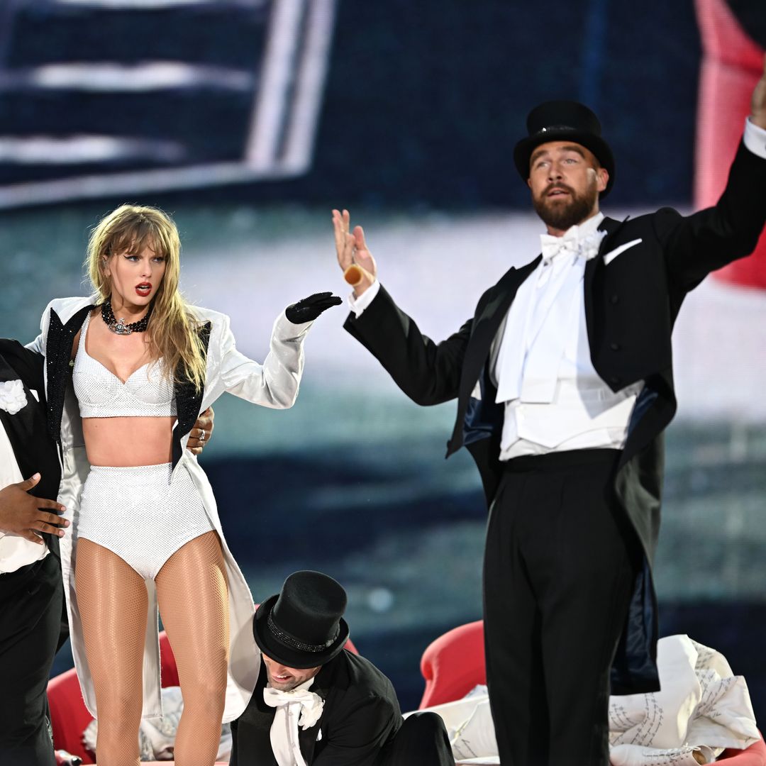 Watch Travis Kelce carry Taylor Swift for surprise appearance on stage during Eras Tour show