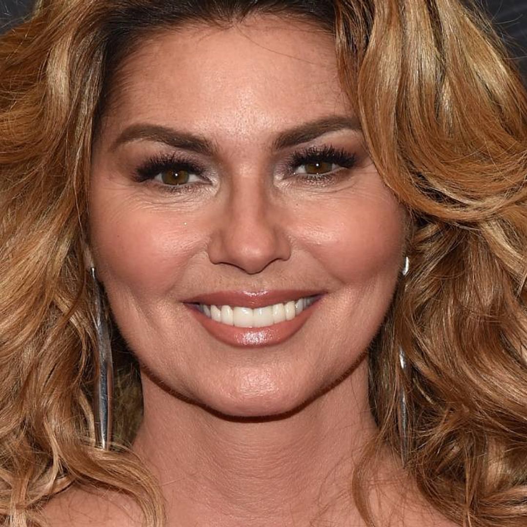 Shania Twain wows in sheer mini dress and thigh-high boots as embraces cheering fans