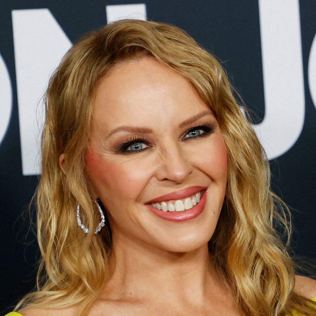 Kylie Minogue shows off bronzed figure in sensational mini dress in unexpected colour
