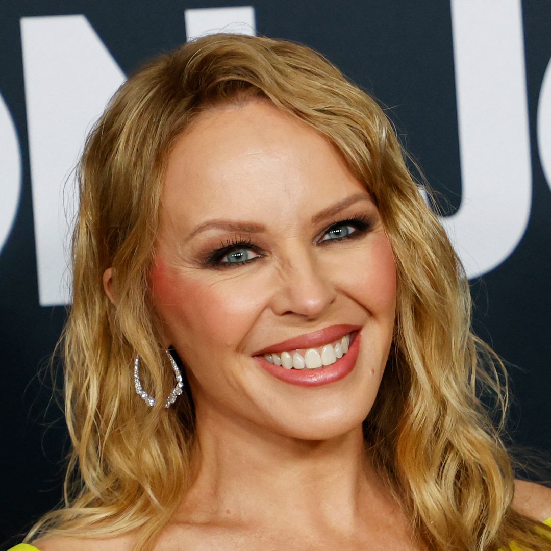 Kylie Minogue is stunning in mini dress with surprising accessory