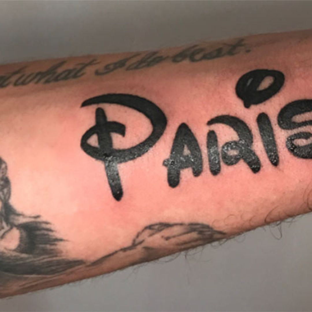 Paris Hilton's boyfriend gets her name tattooed in his arm - in Disney font!