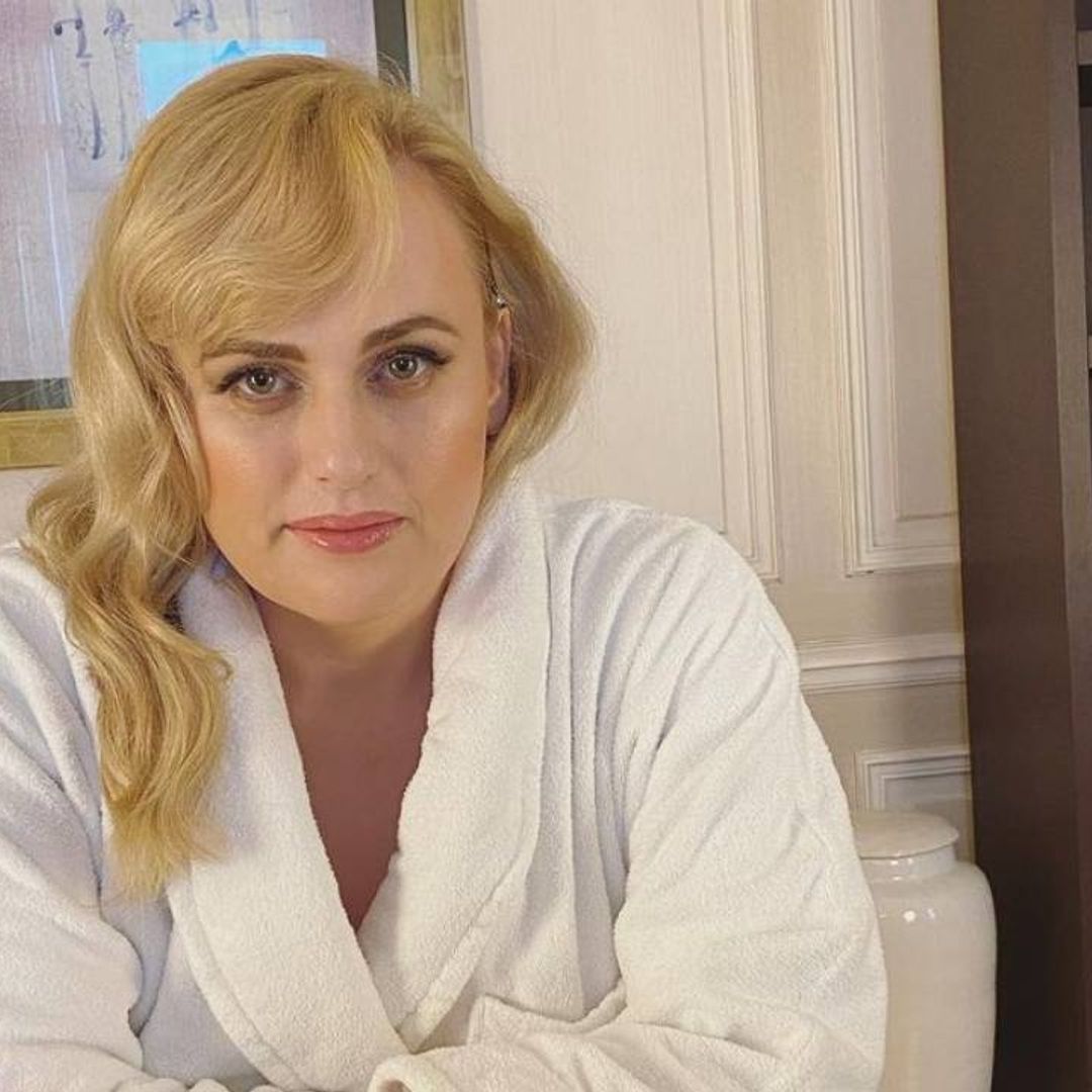 Rebel Wilson looks stunning in white skinny jeans as she poses by the sea