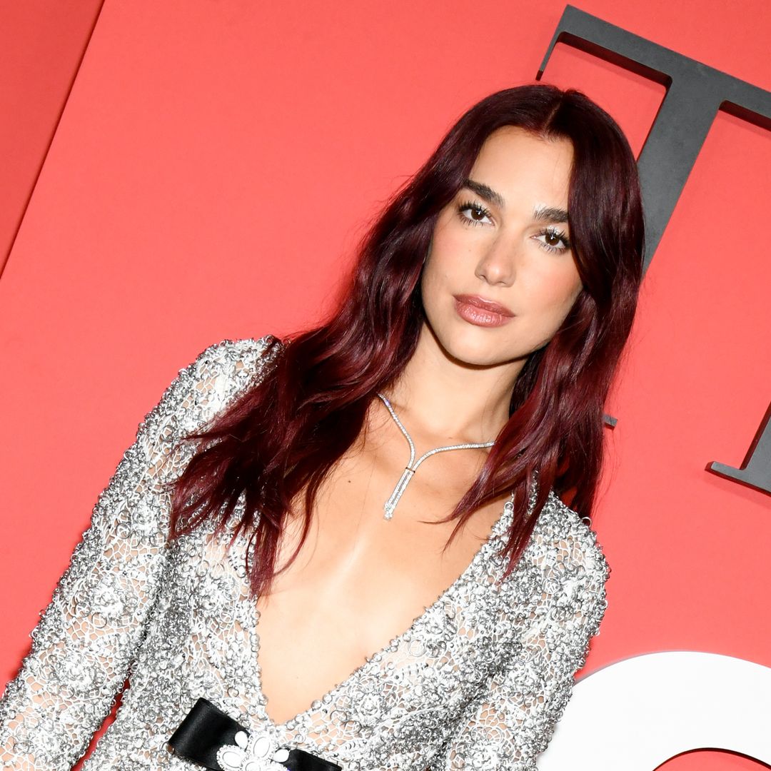 Dua Lipa is a disco queen in crystal-clad bustier dress and knee-high boots