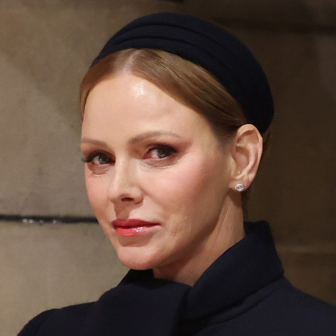 Princess Charlene is 'statuesque' in knee-high boots and £2.7k Prada bag